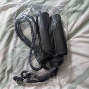 Resistance workout bands with handles and carabiners.